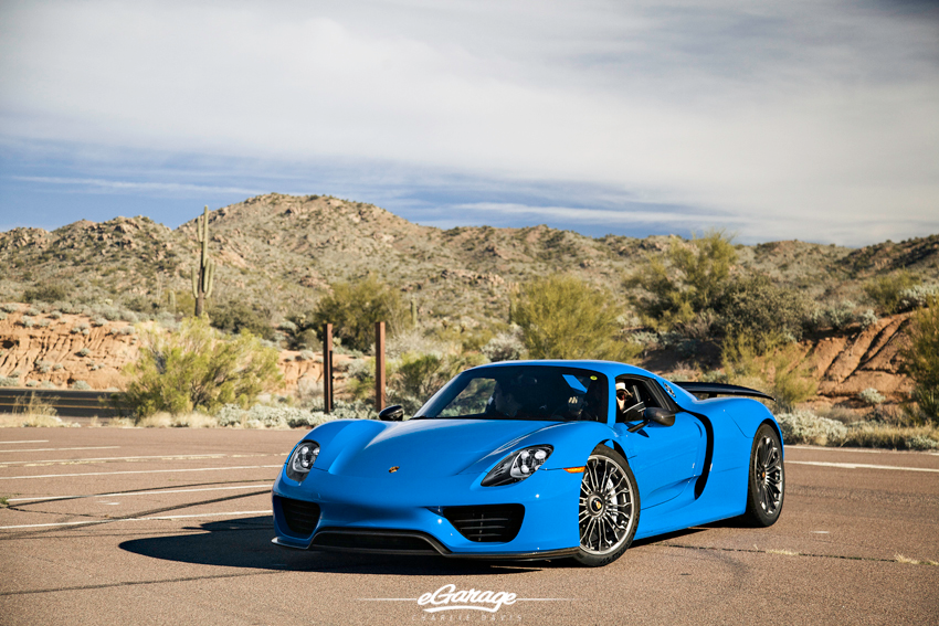 Blue Porsche 918 parked